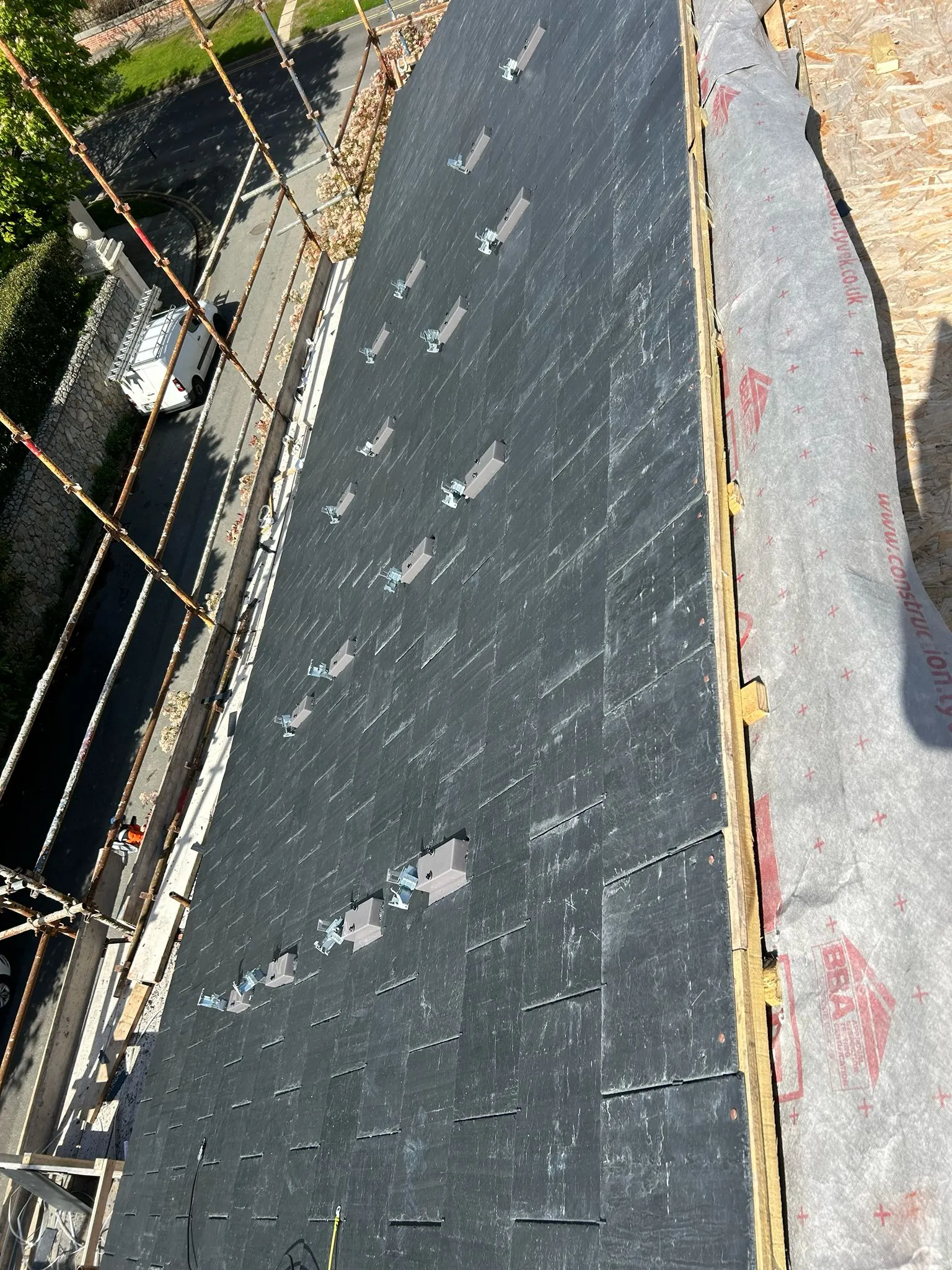 New Spanish slates on a new roof, solar panel brackets fitted — photo 3