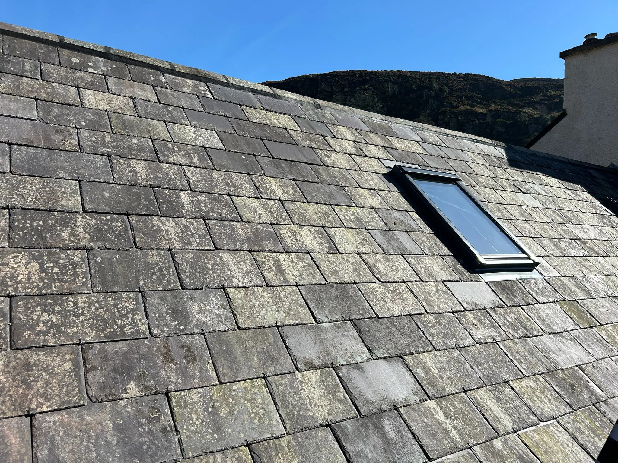 Existing slates being re-used on a farm roof — photo 4