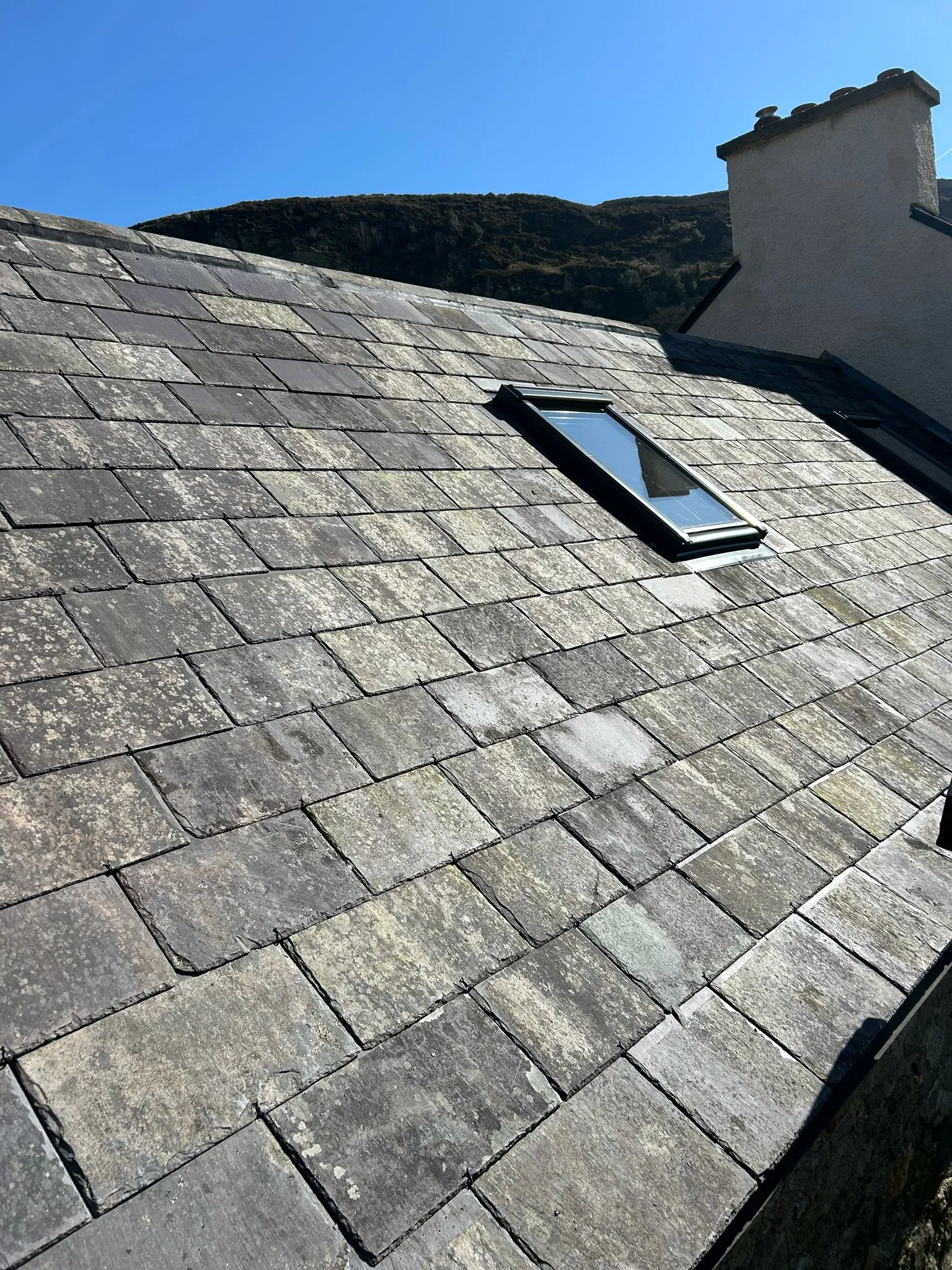Existing slates being re-used on a farm roof — photo 5