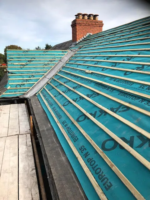 Roof being replaced. Existing Bangor slates on the front and side slopes. New Spanish slates on the back — photo 10