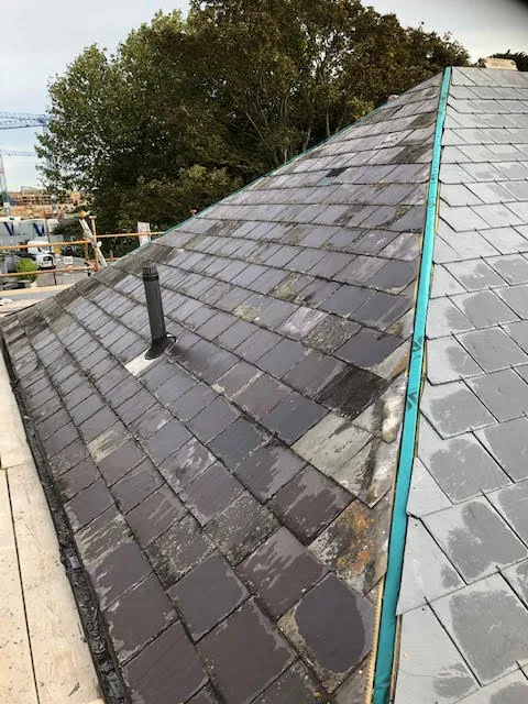 Roof being replaced. Existing Bangor slates on the front and side slopes. New Spanish slates on the back — photo 17