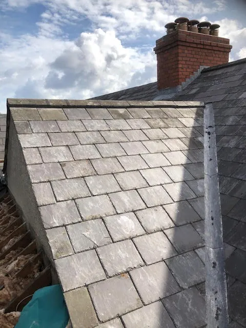 Roof being replaced. Existing Bangor slates on the front and side slopes. New Spanish slates on the back — photo 19