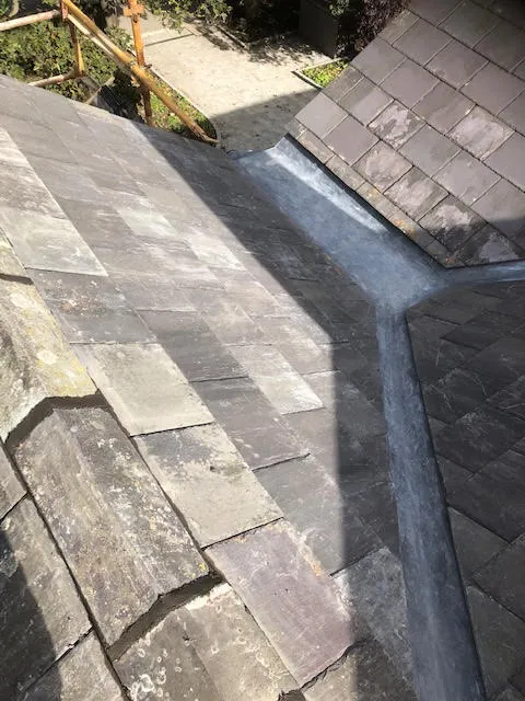 Roof being replaced. Existing Bangor slates on the front and side slopes. New Spanish slates on the back — photo 22