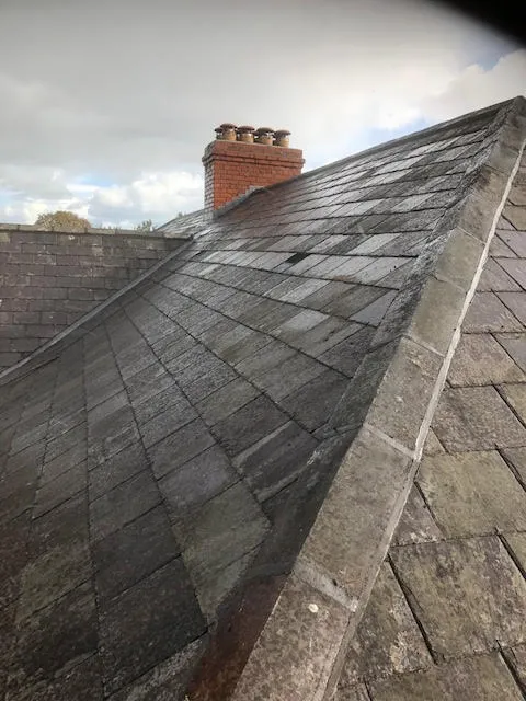 Roof being replaced. Existing Bangor slates on the front and side slopes. New Spanish slates on the back — photo 23