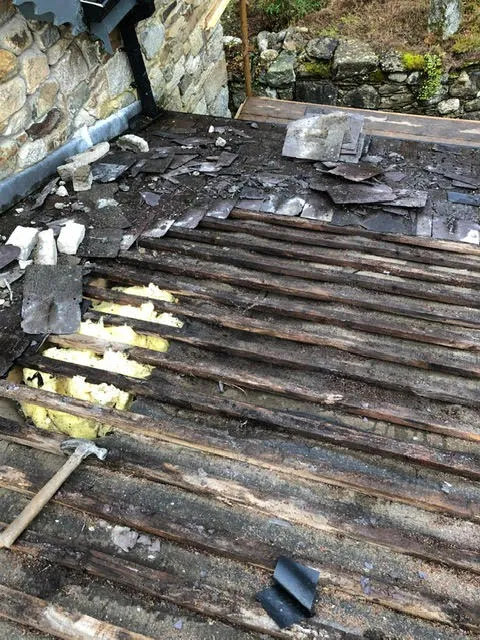 Badly leaking roof being replaced — photo 2