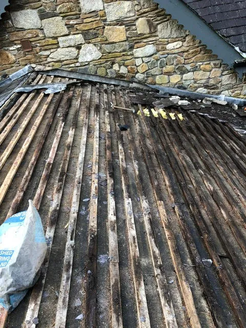 Badly leaking roof being replaced — photo 4